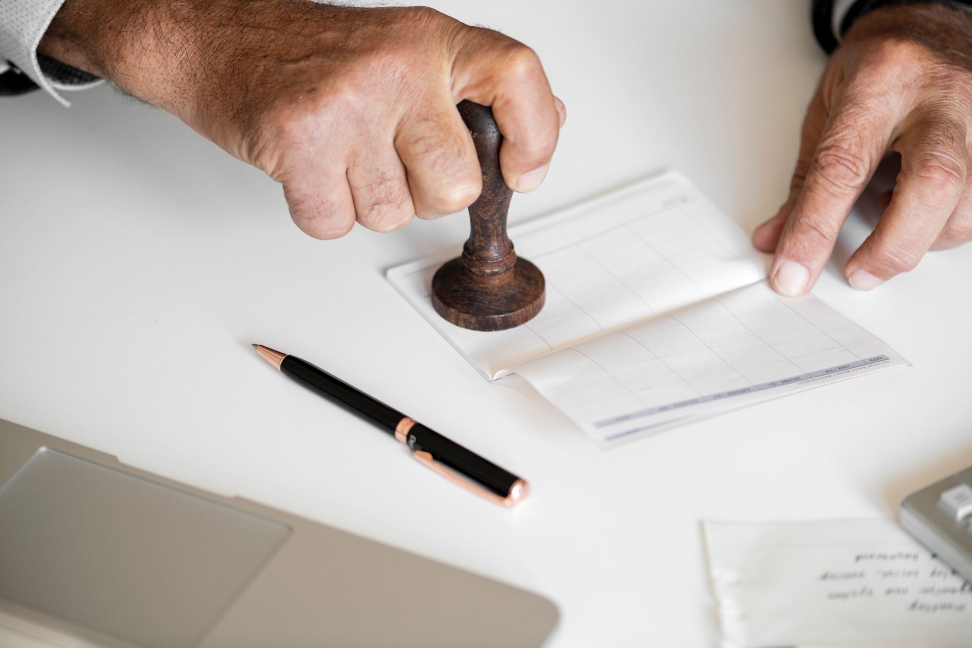 a person cutting a piece of paper